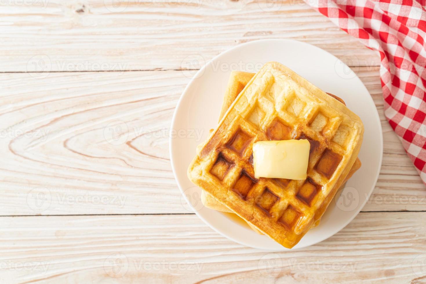 Waffle stack with butter and honey photo