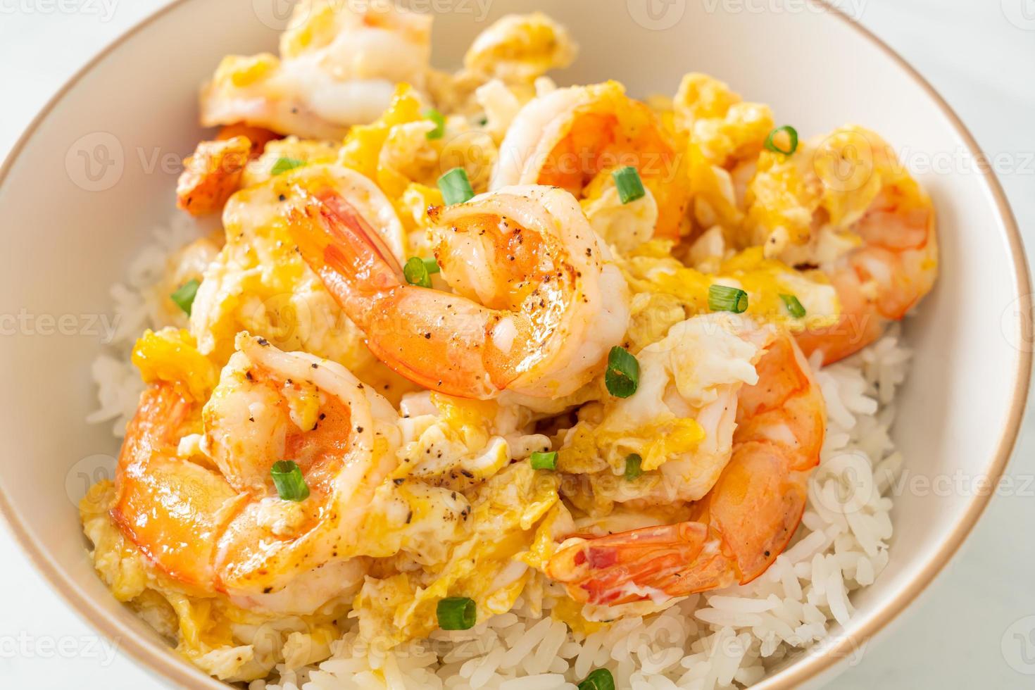 Creamy omelet with shrimps rice bowl photo