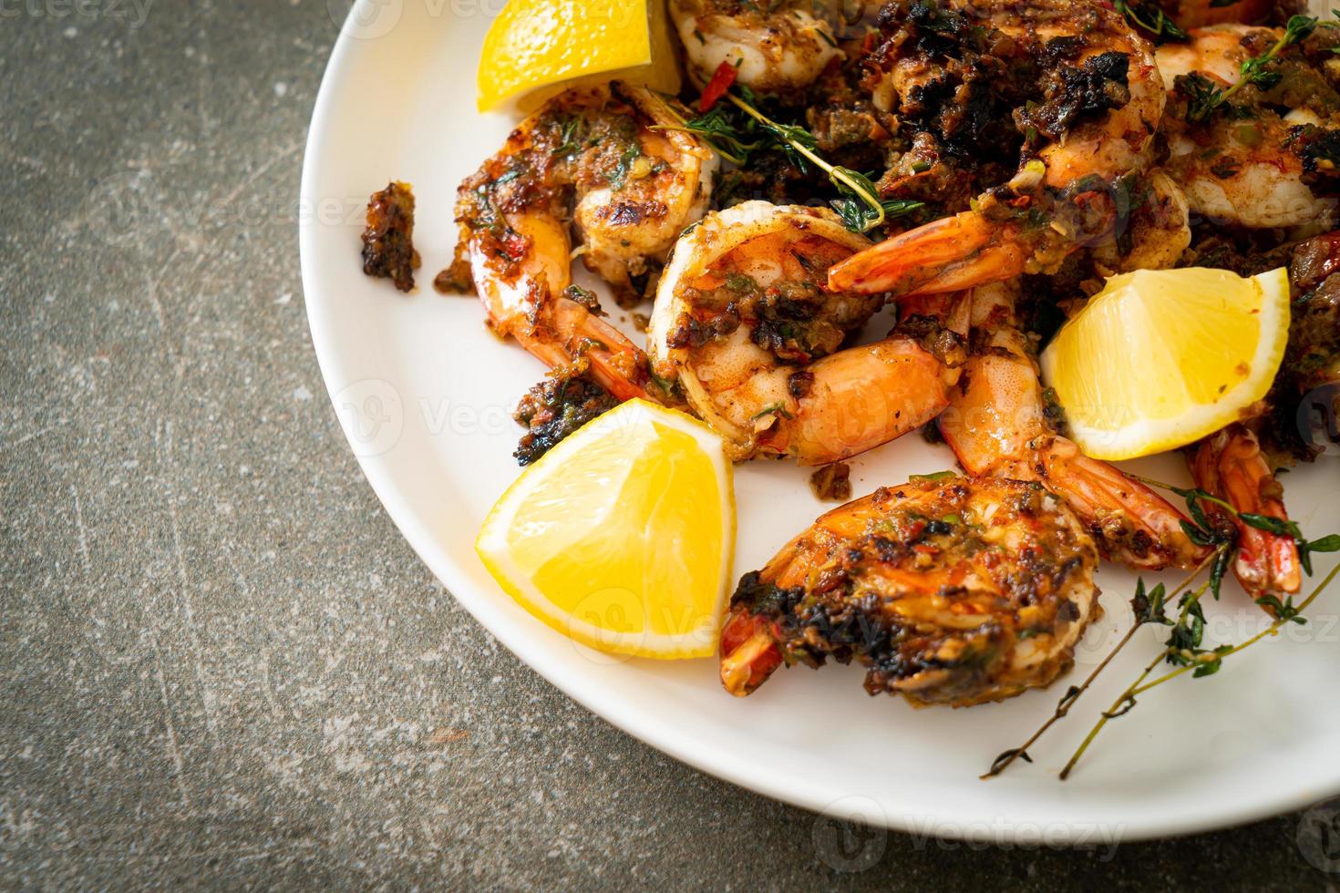 Jerk shrimps or grilled shrimps in Jamaica style with rice photo