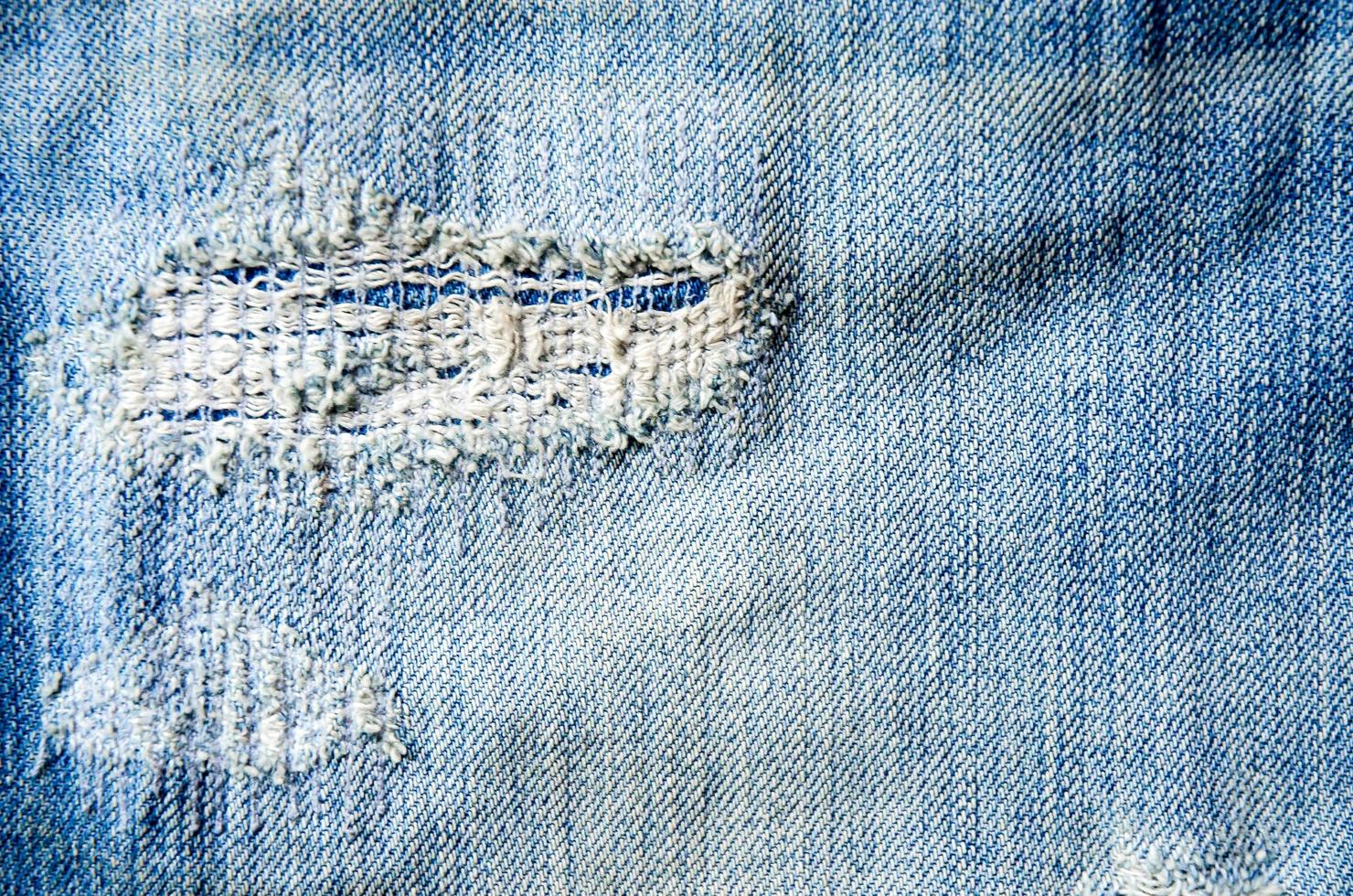 Blue jeans lack and jeans texture on the wooden floor photo