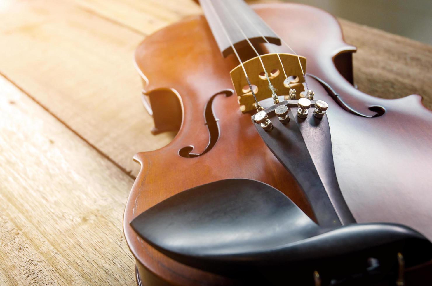 The violin on the table, Close up of violin on the wooden floo photo