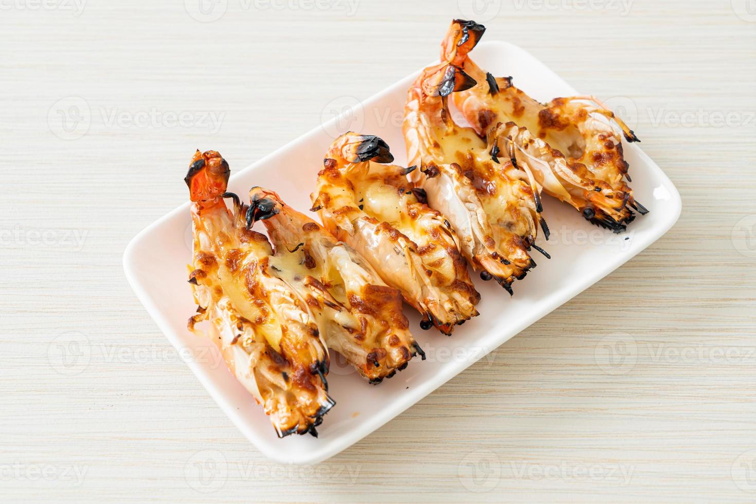 Grilled river prawns or shrimps with cheese photo