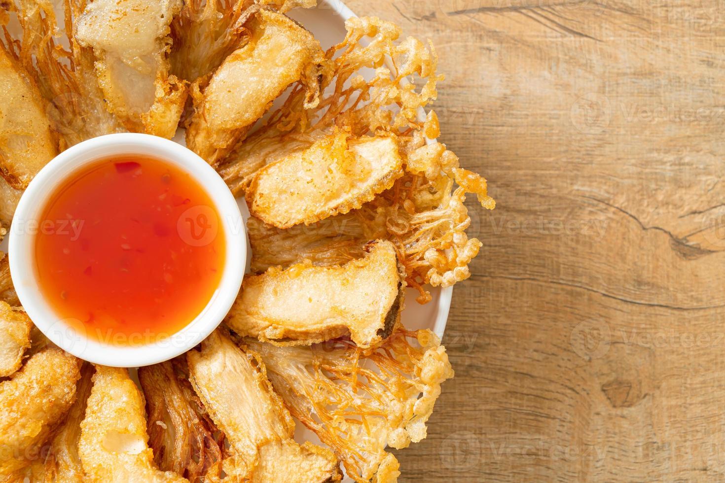 Deep fried enoki mushroom with spicy dipping sauce photo