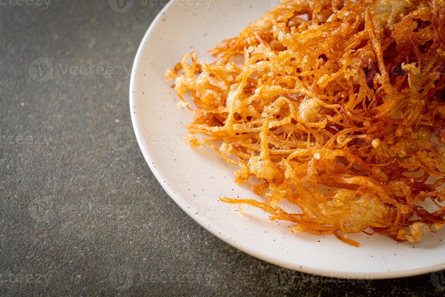 Fried enoki mushroom or golden needle mushroom photo