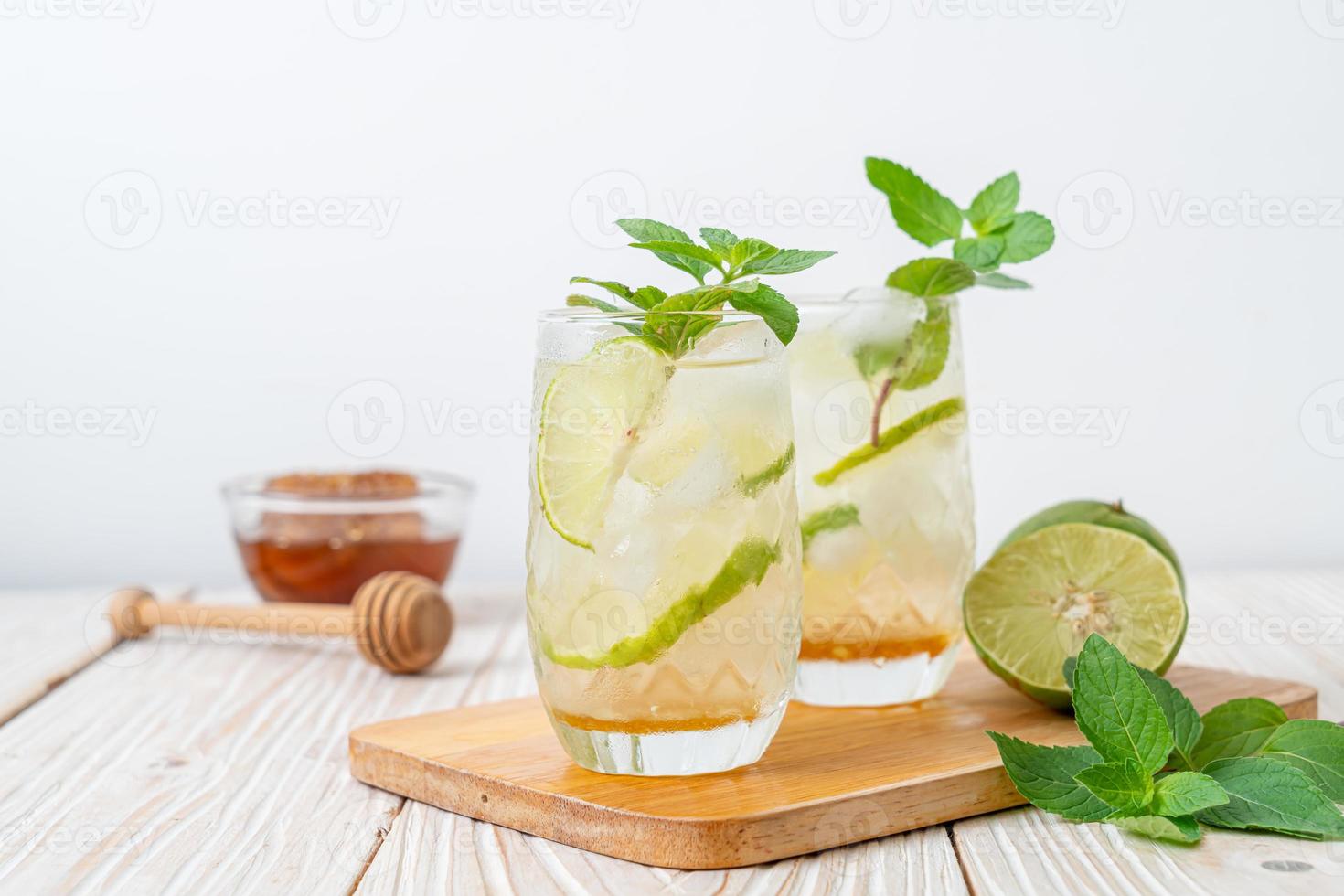 Iced honey and lime soda with mint photo