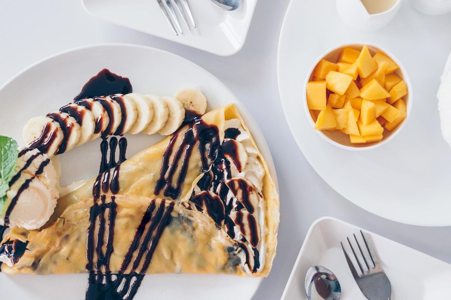Bingsu mango and Shaved ice desserts, Chocolate crepe and vanilla. photo