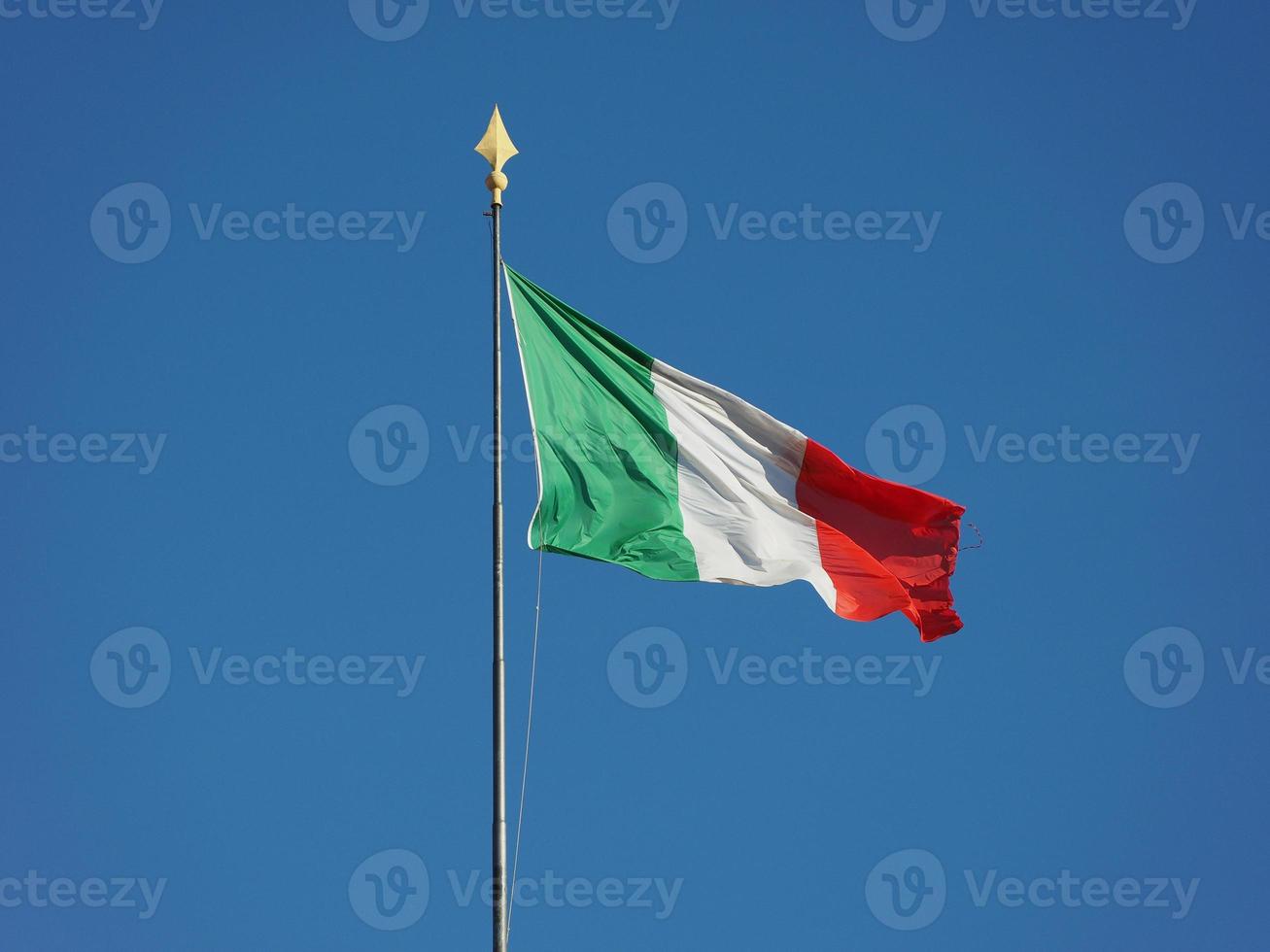 Italian Flag of Italy over blue sky photo