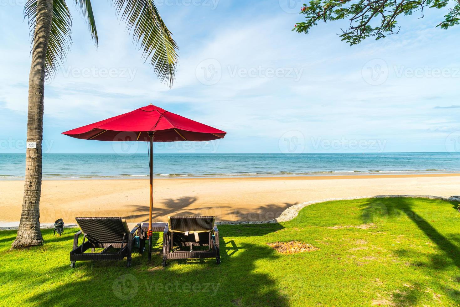 Umbrella and chair  with sea ocean view in hotel resort photo