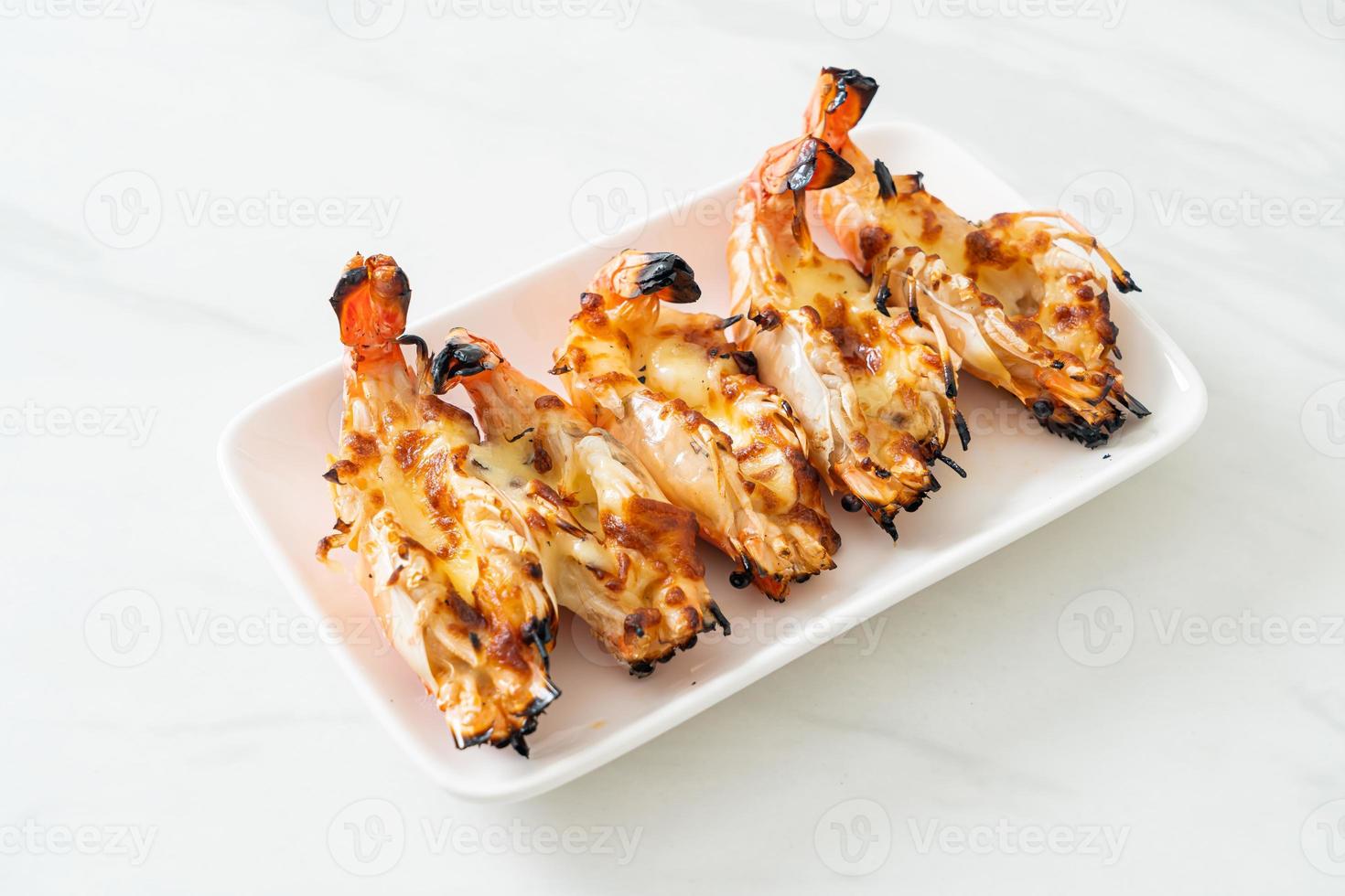 Grilled river prawns or shrimps with cheese photo