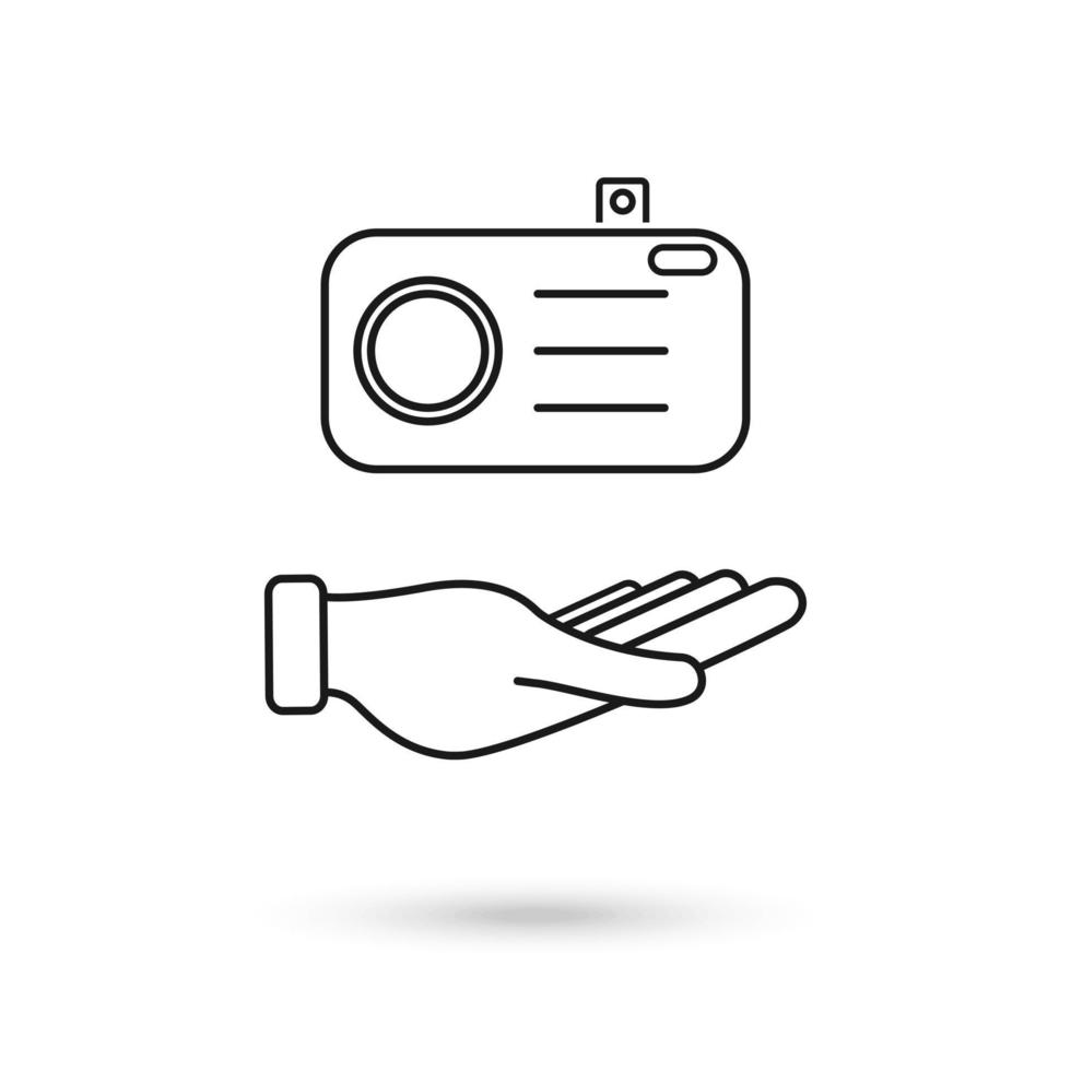 Hand holding a photographic camera icon vector