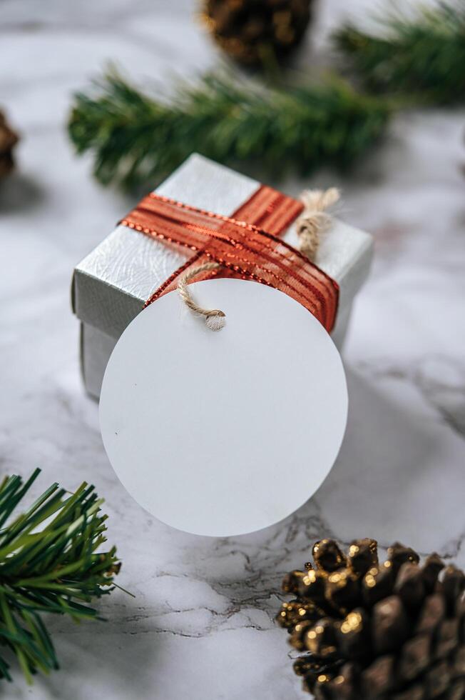 Gift boxes with small gifts on white cement photo