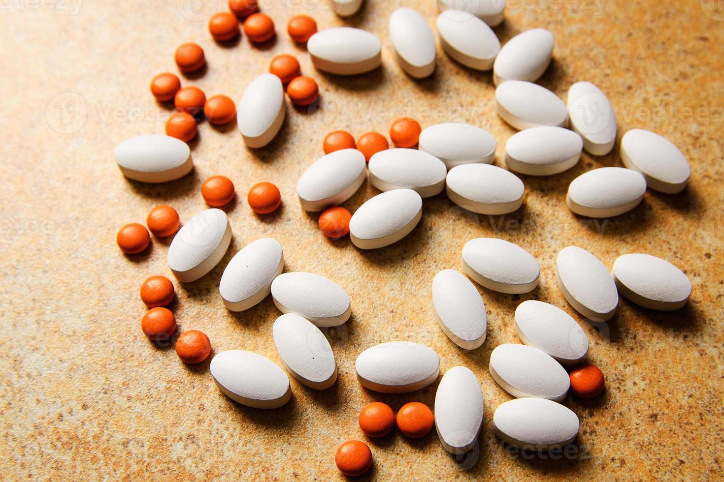Orange and white pills photo