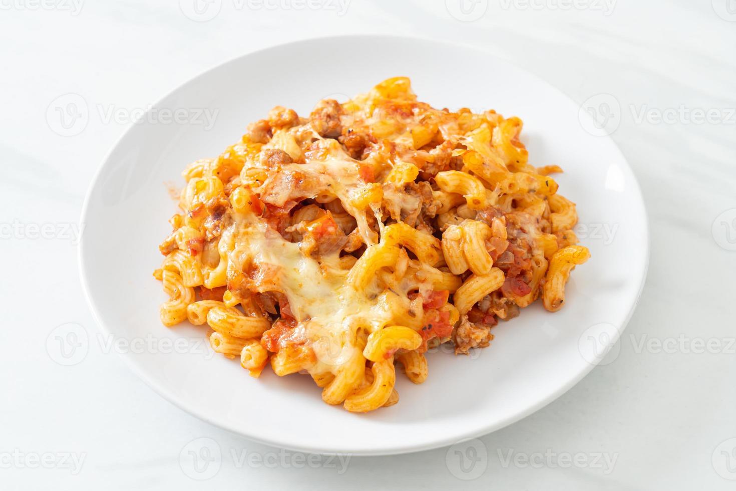 Homemade macaroni bolognese with cheese photo