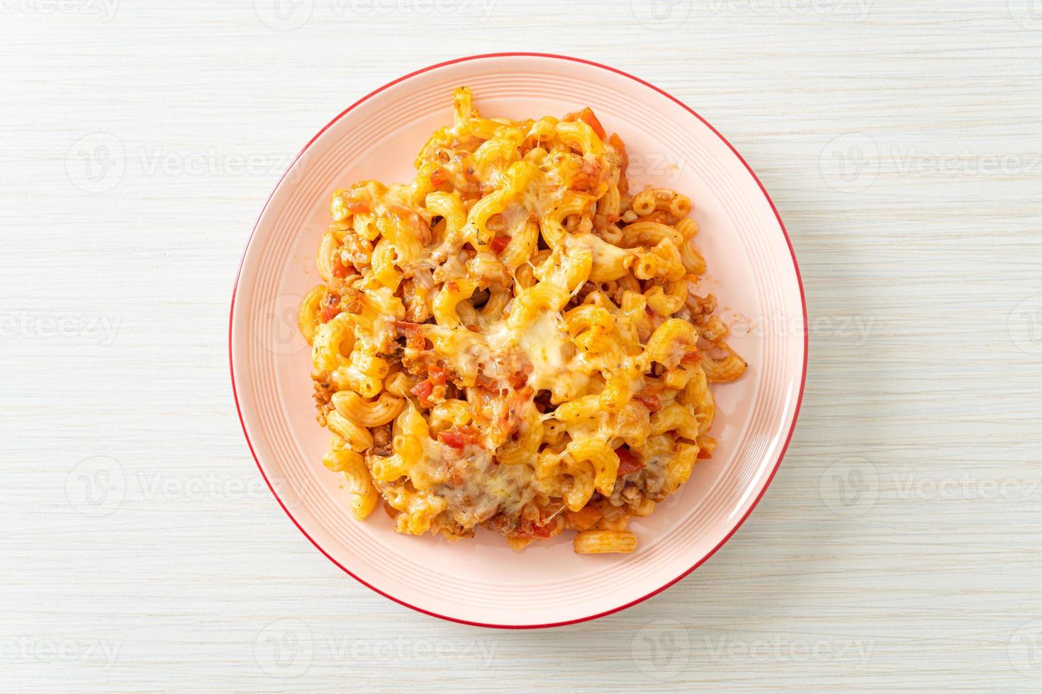 Homemade macaroni bolognese with cheese photo