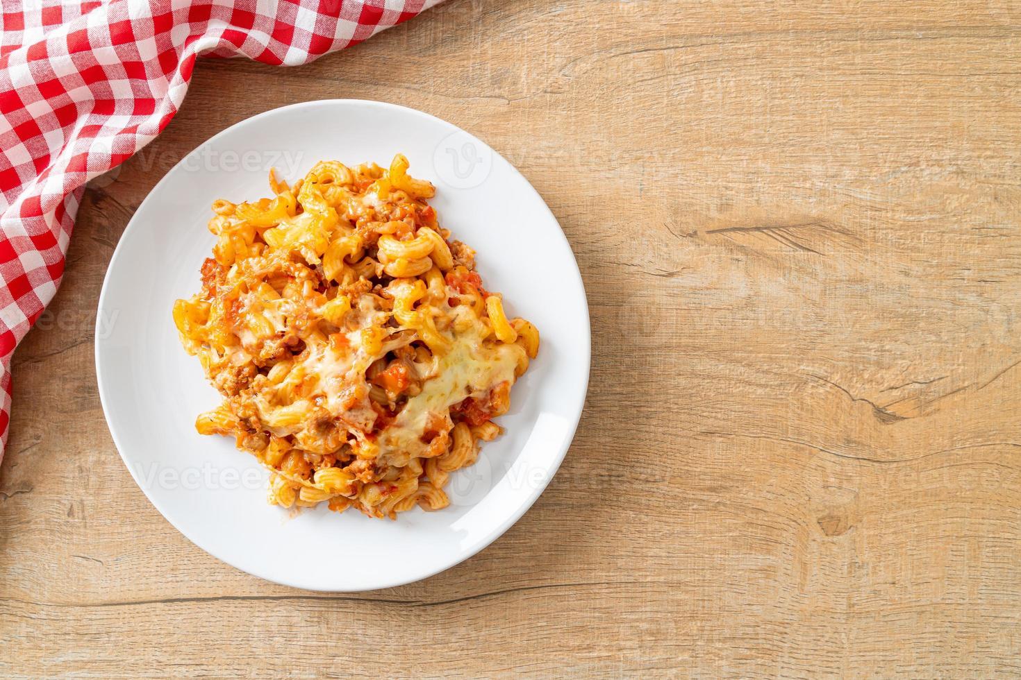 Homemade macaroni bolognese with cheese photo