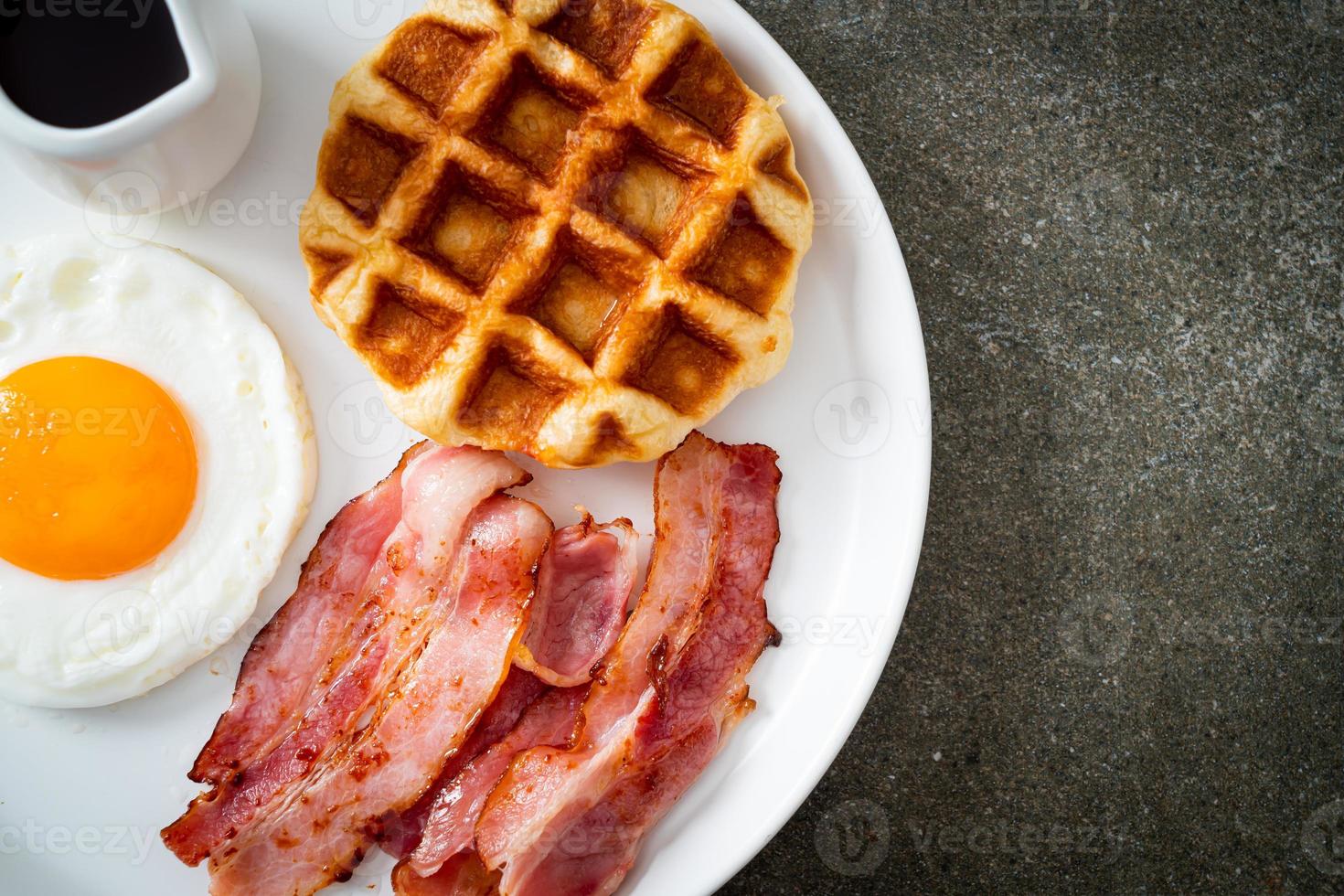 Fried egg with bacon and waffle photo