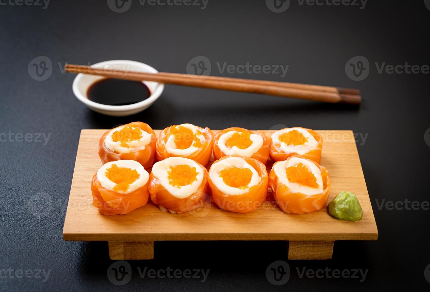 Fresh salmon sushi roll with mayonnaise and shrimp egg photo