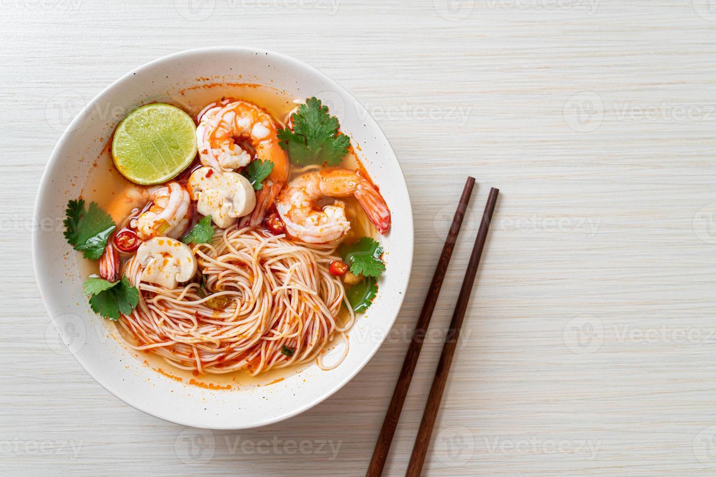 Noodles with spicy soup and shrimps photo