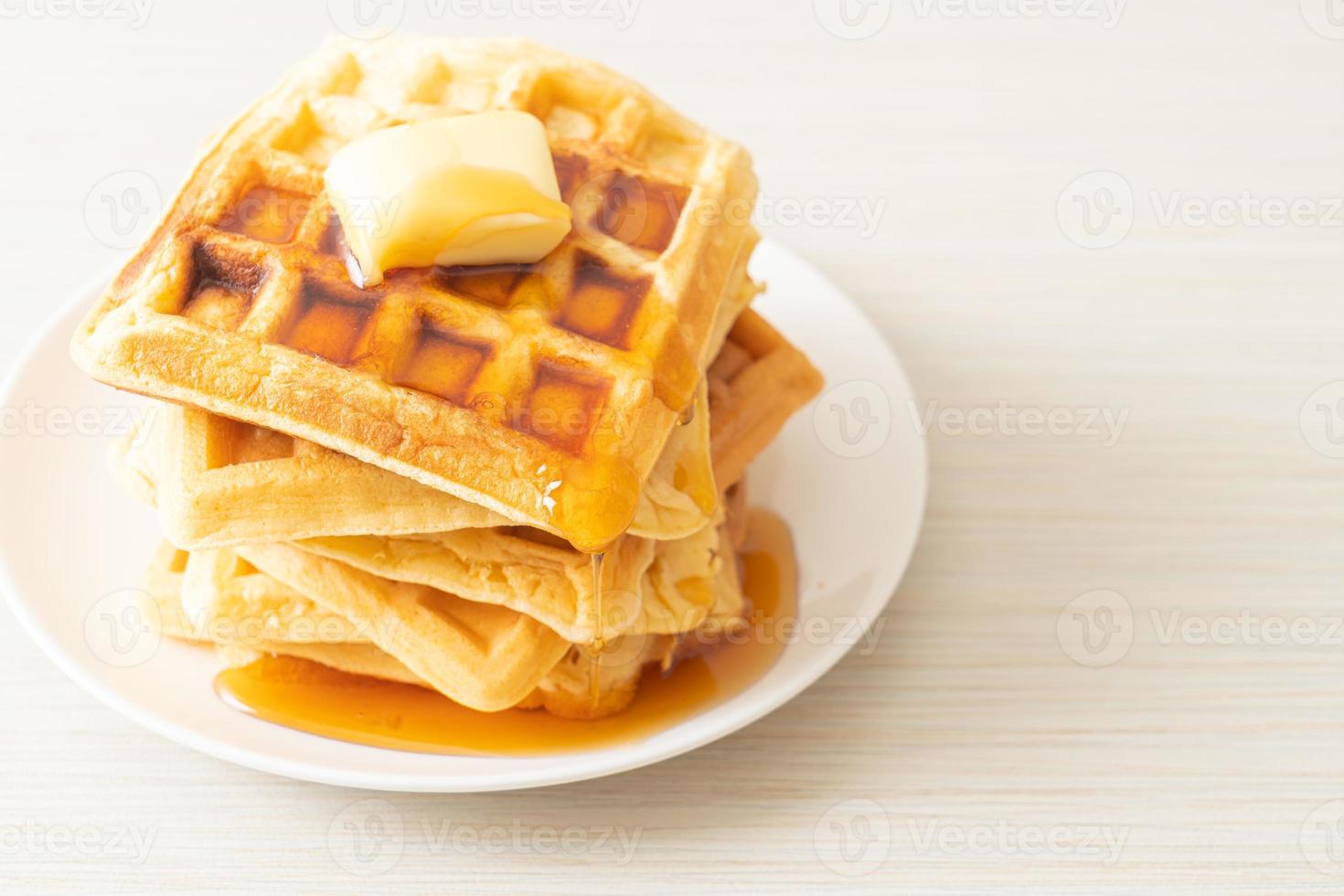 Waffle stack with butter and honey photo