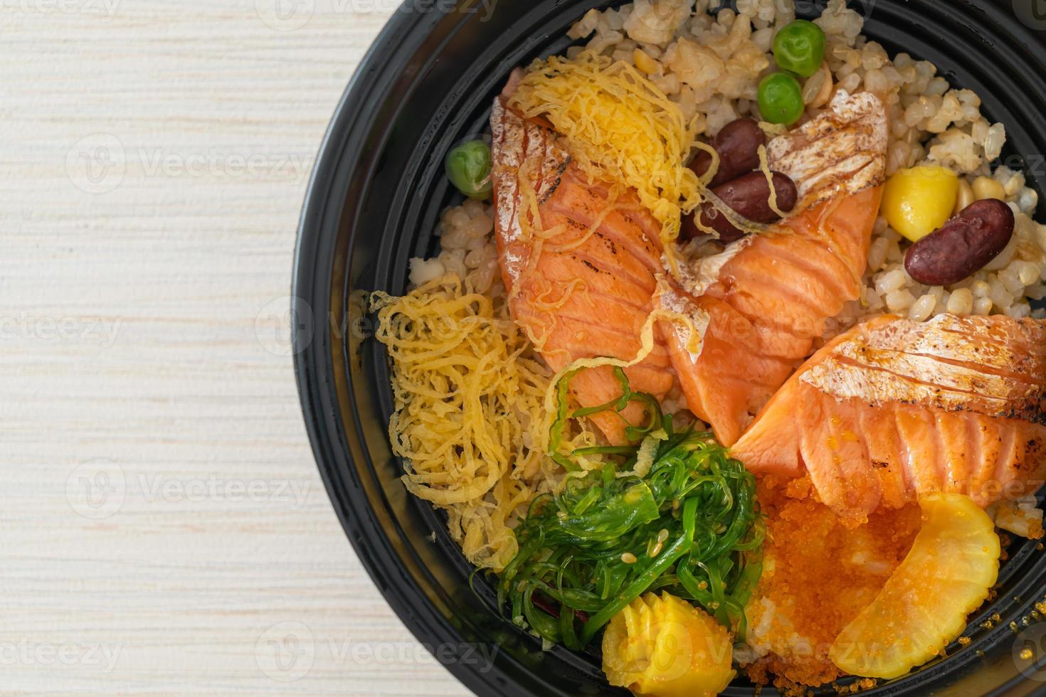 Grilled salmon with brown rice donburi photo