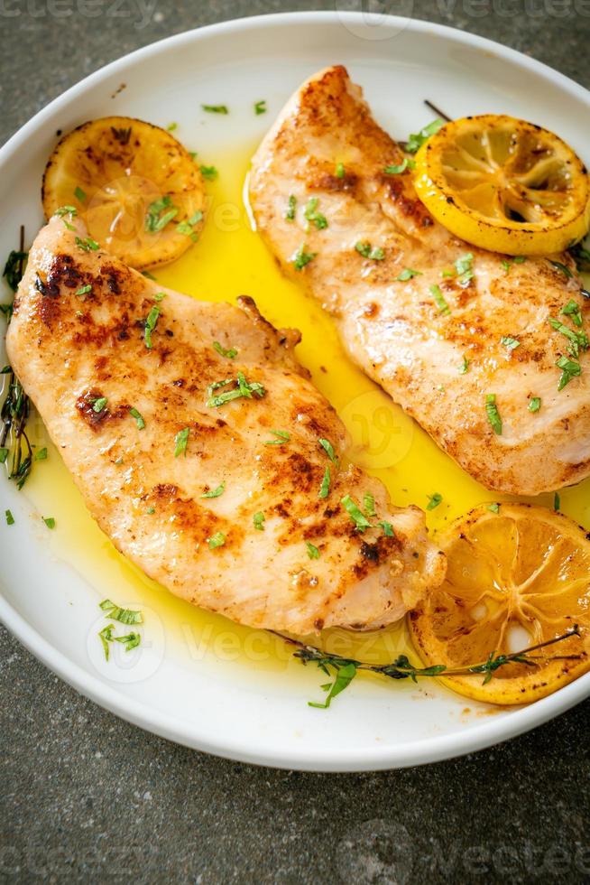 Grilled chicken with butter, lemon and garlic photo