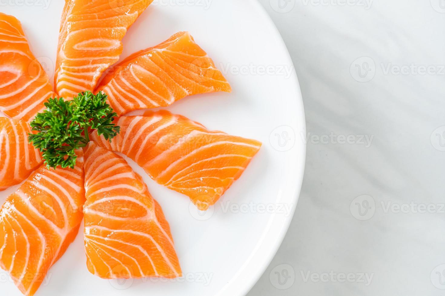 Fresh salmon raw sashimi on plate photo