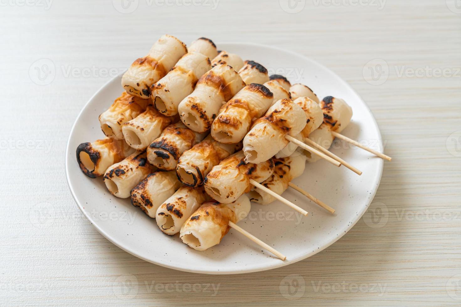 Grilled tube shaped fish paste cake skewe or tube squid skewer photo