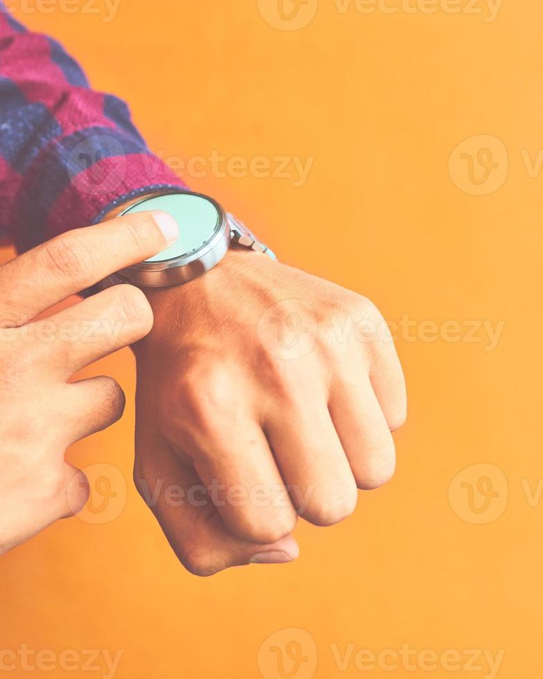 Man wears a smart watch in everyday lifestyle photo