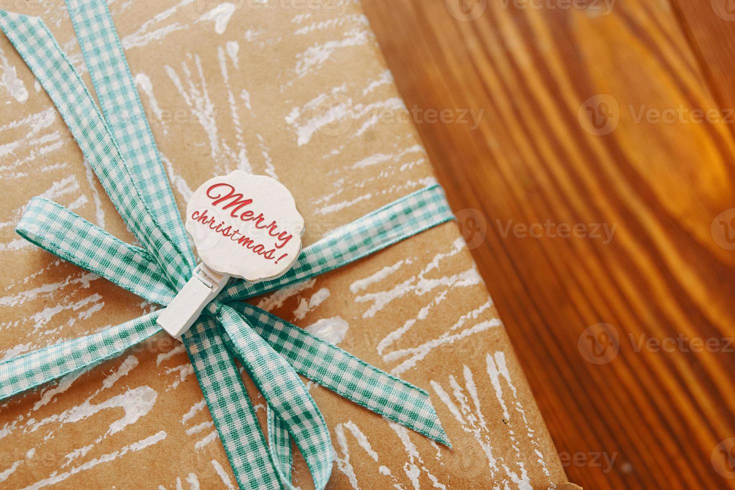 Gift box on wooden table photo