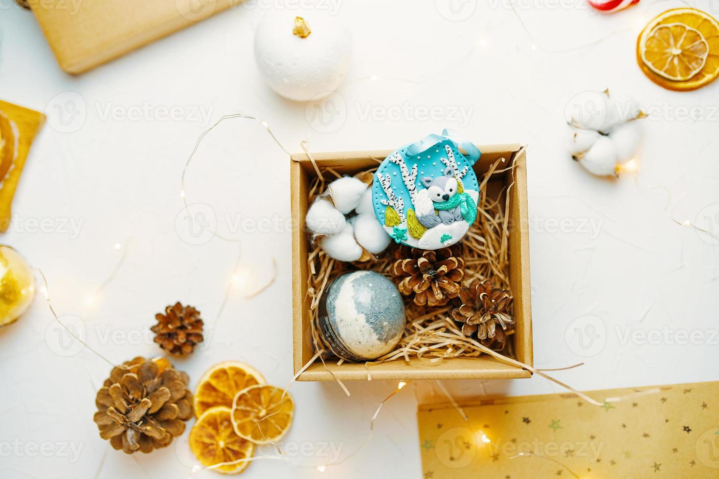 Christmas gift box with cute souvenir made of polymer clay photo