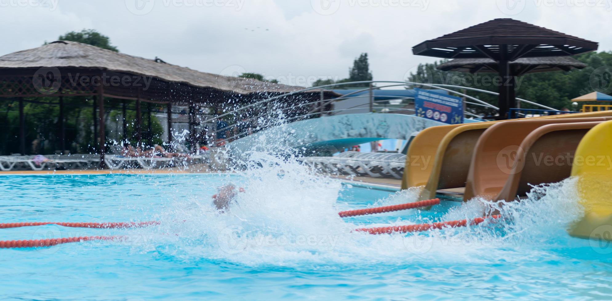 Colorful plastic slides in aquapark photo