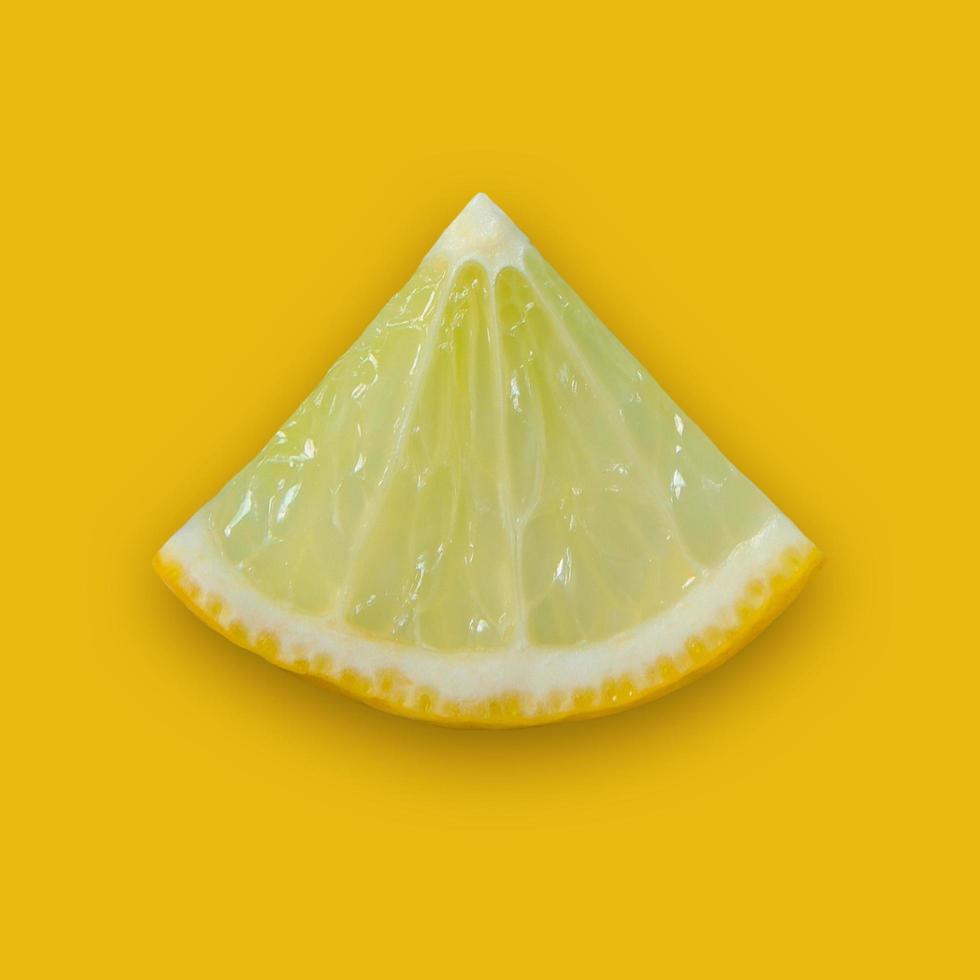 Lemon and lime slice and fresh citrus fruit on yellow background. photo