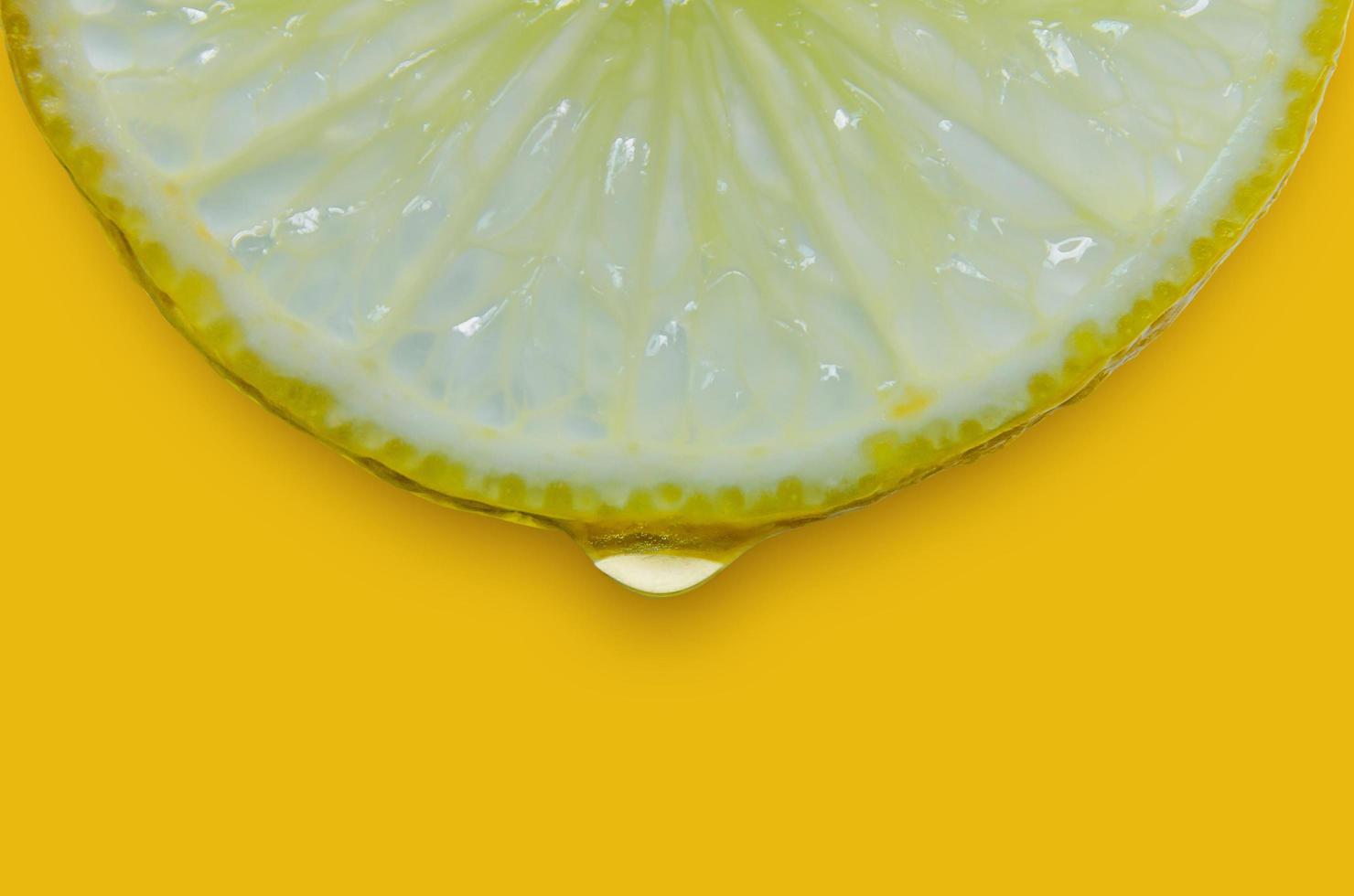 Lemon and lime slice and fresh citrus fruit on yellow background. photo