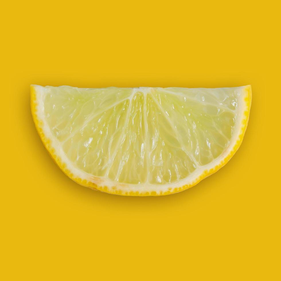 Lemon and lime slice and fresh citrus fruit on yellow background. photo