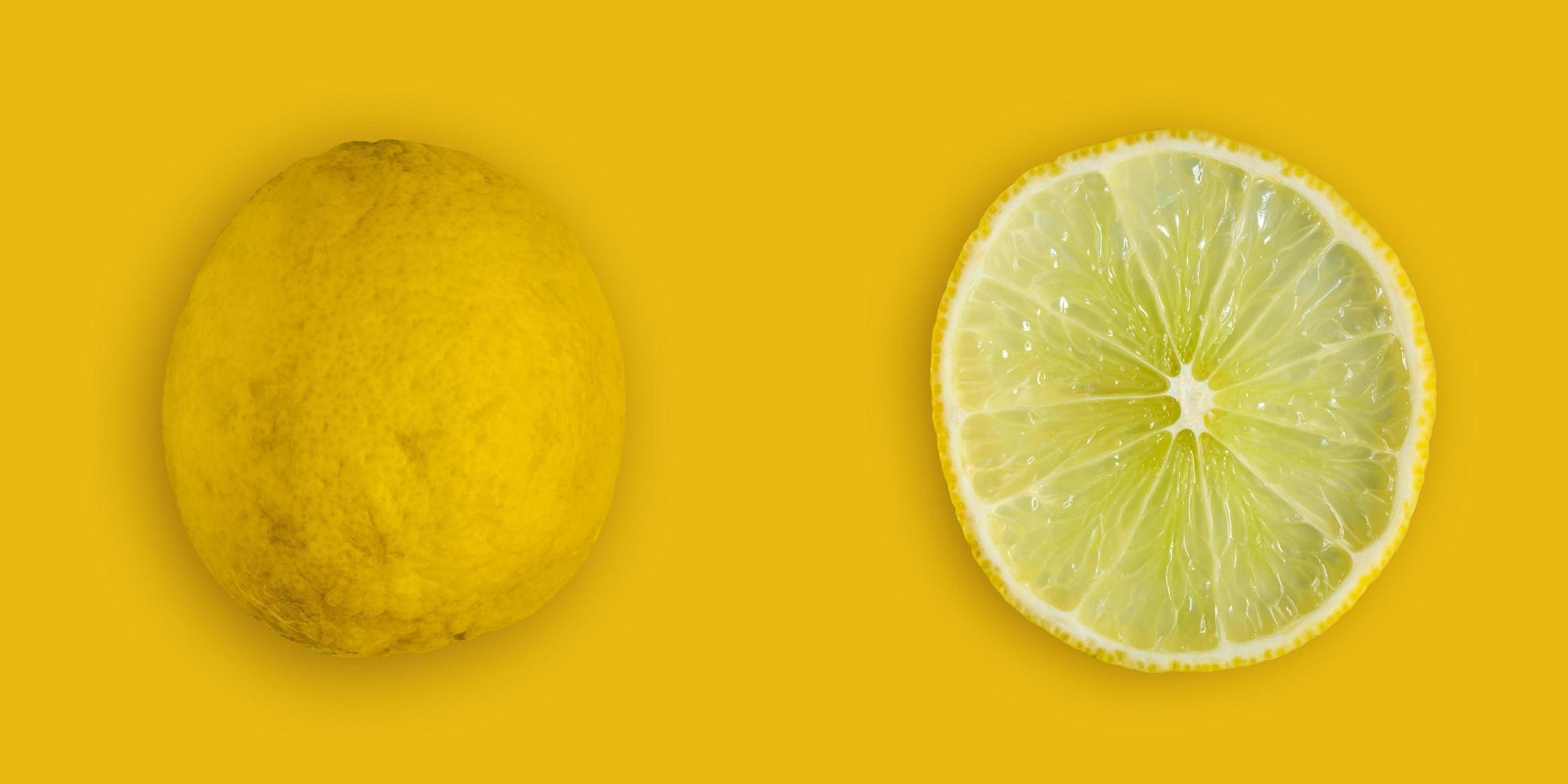 Lemon and lime slice and fresh citrus fruit on yellow background. photo
