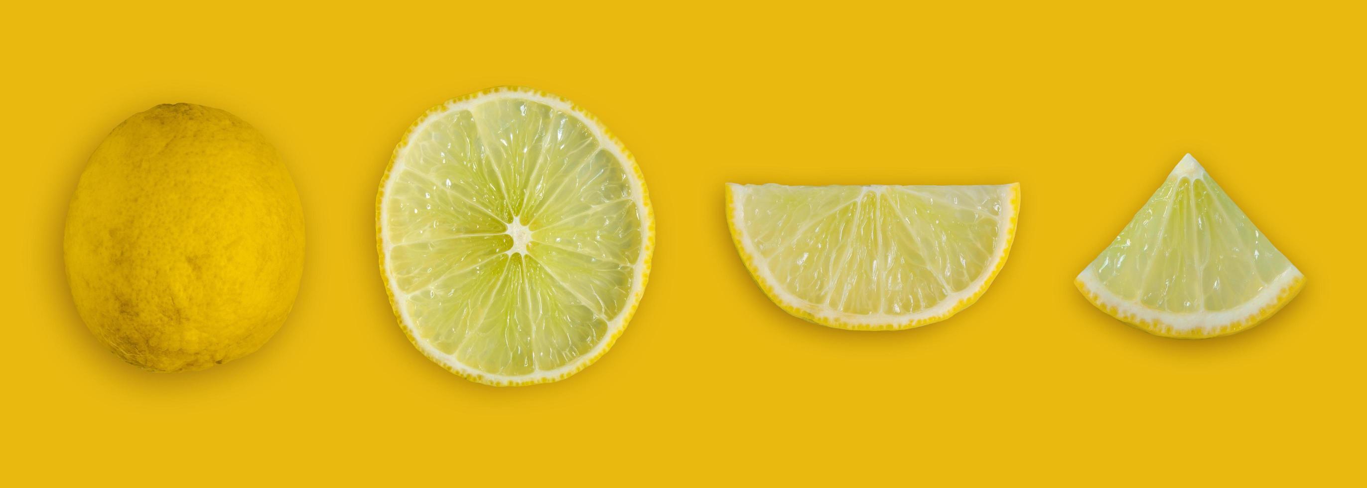 Lemon and lime slice and fresh citrus fruit on yellow background. photo