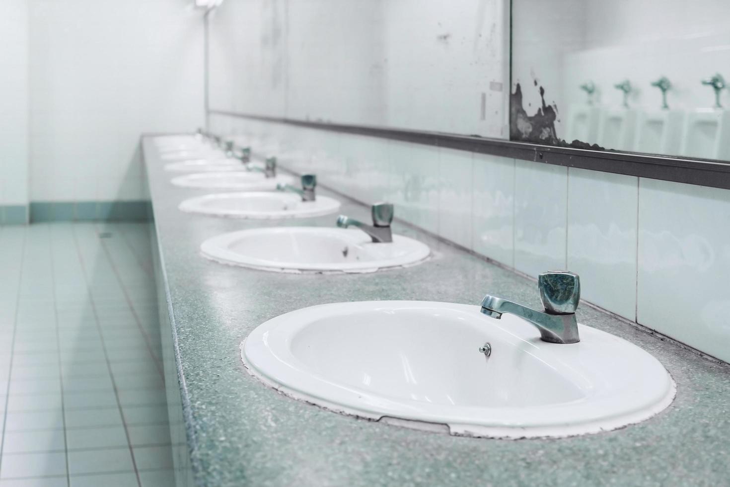 Public toilet and Bathroom interior with wash basin and toilet room. photo