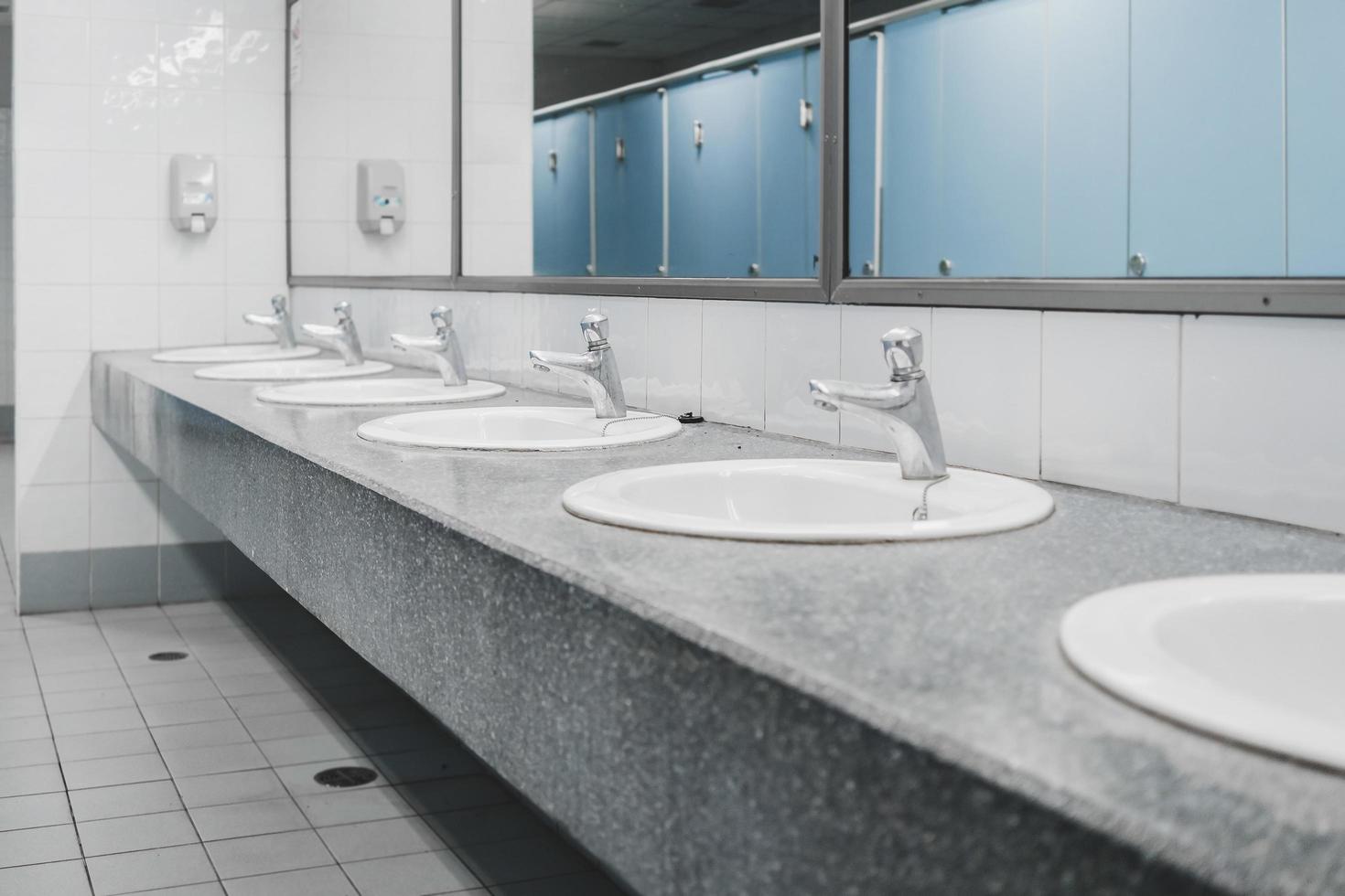 Public toilet and Bathroom interior with wash basin and toilet room. photo
