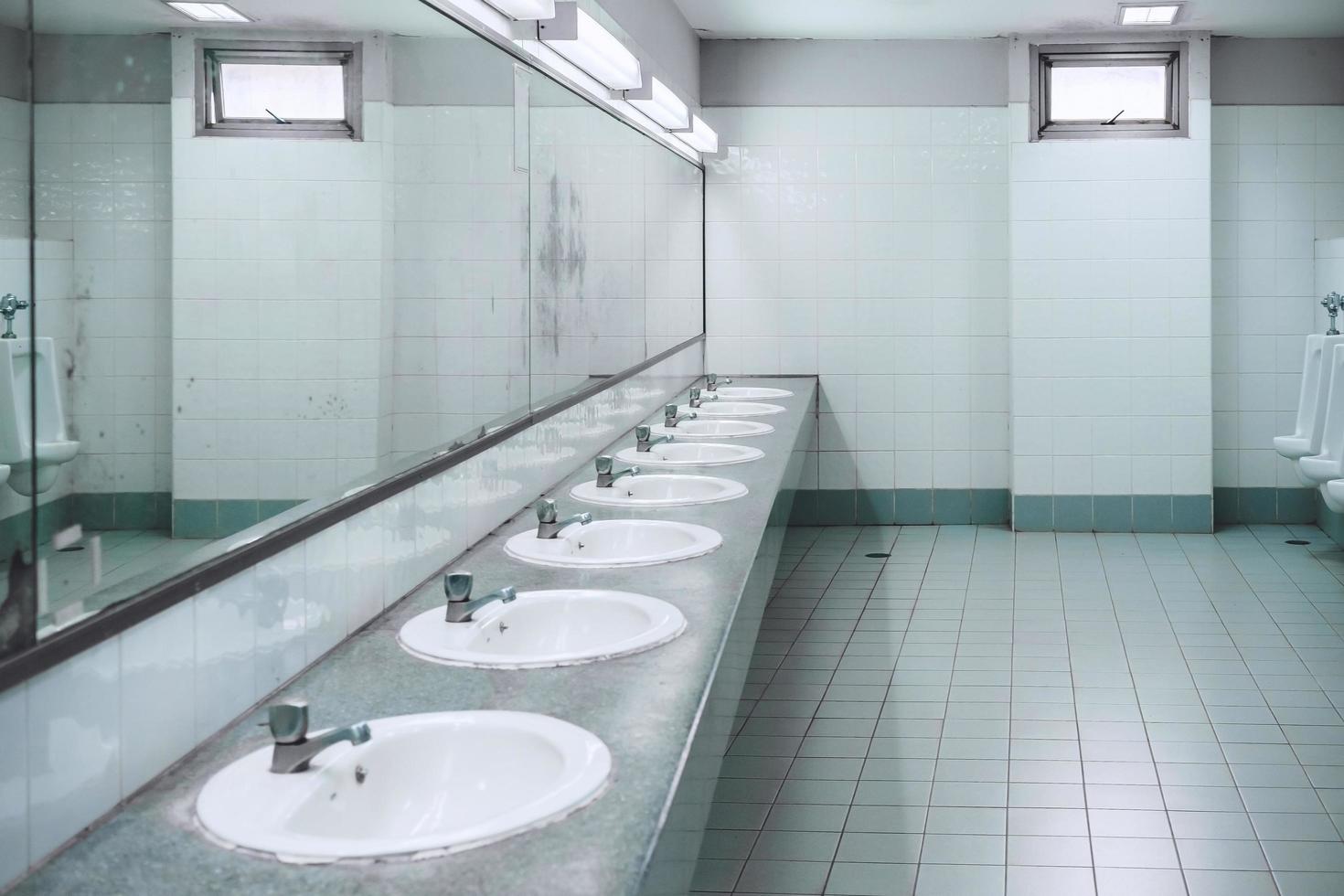 Public toilet and Bathroom interior with wash basin and toilet room. photo