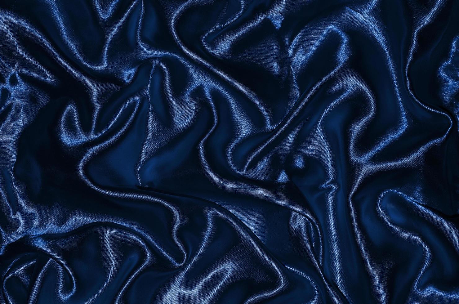 Fondo y papel tapiz de tela azul oscuro y textil a rayas. foto