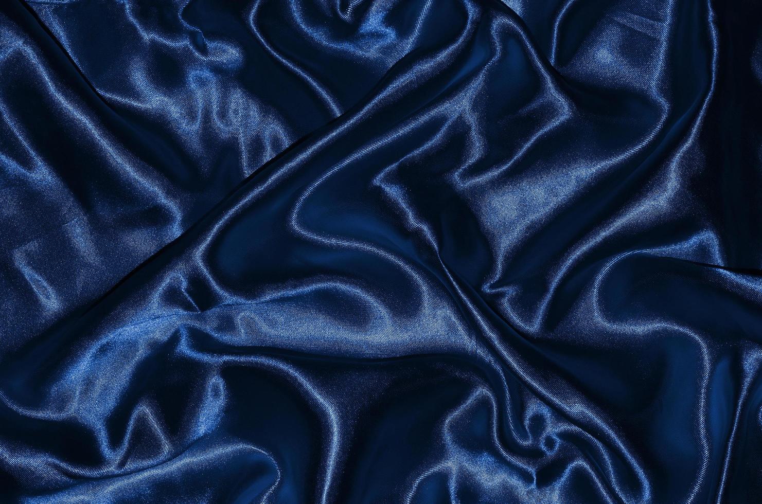 Fondo y papel tapiz de tela azul oscuro y textil a rayas. foto