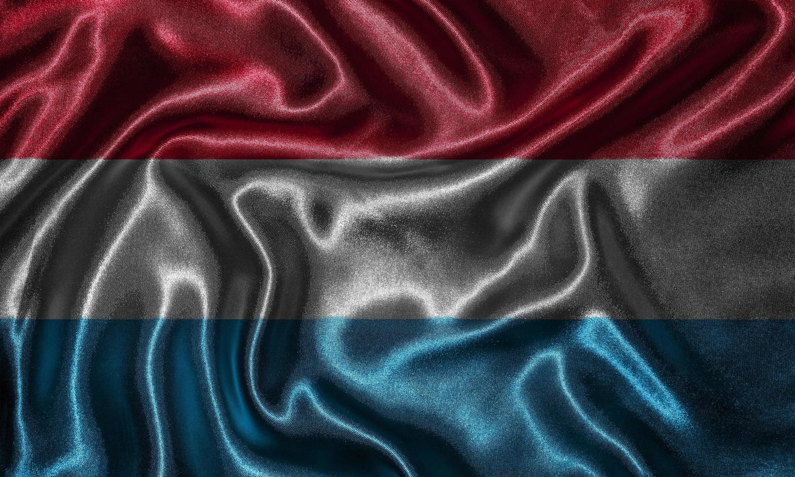 Wallpaper by Luxembourg flag and waving flag by fabric. photo