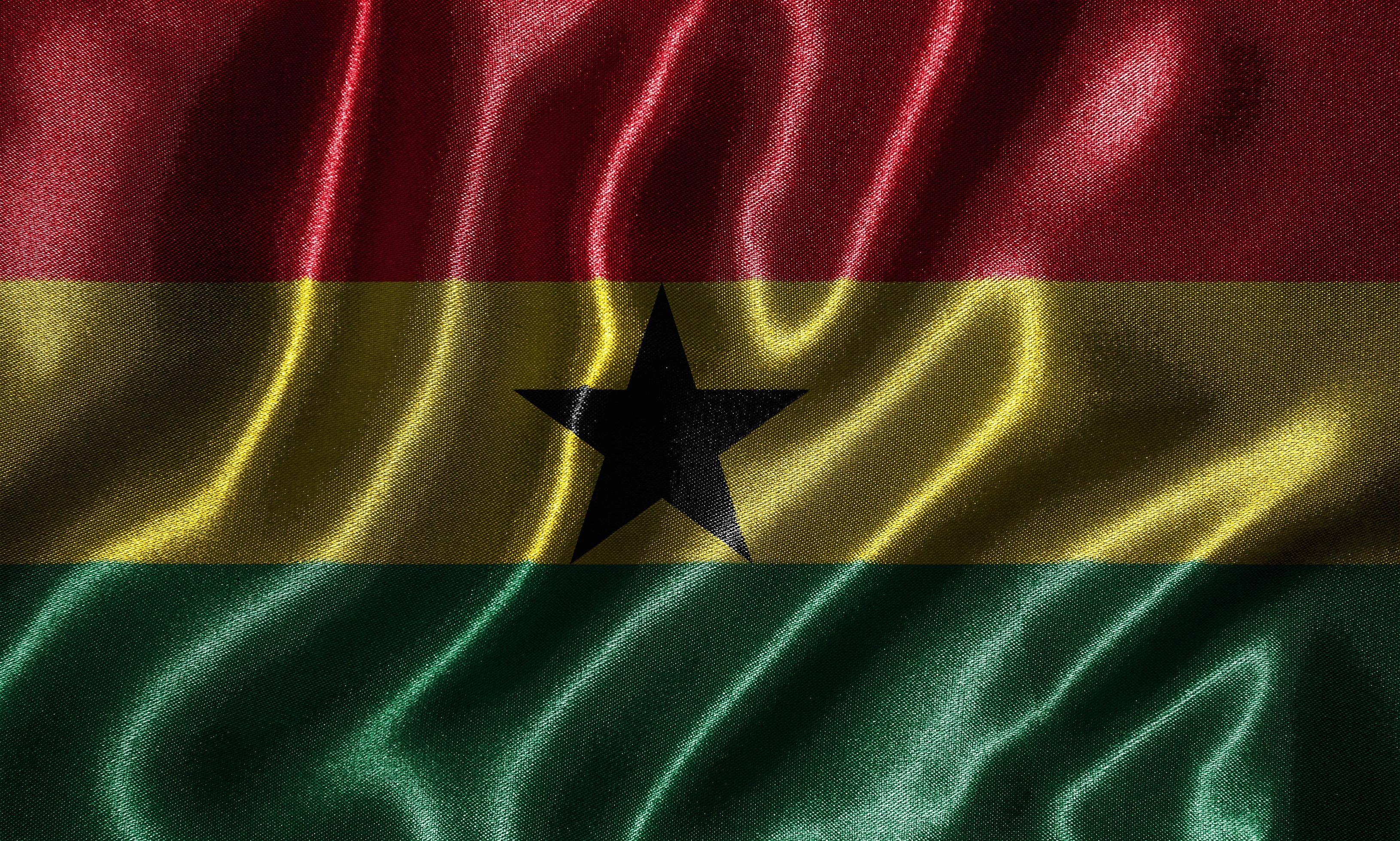 Wallpaper by Ghana flag and waving flag by fabric. 3334711 Stock Photo
