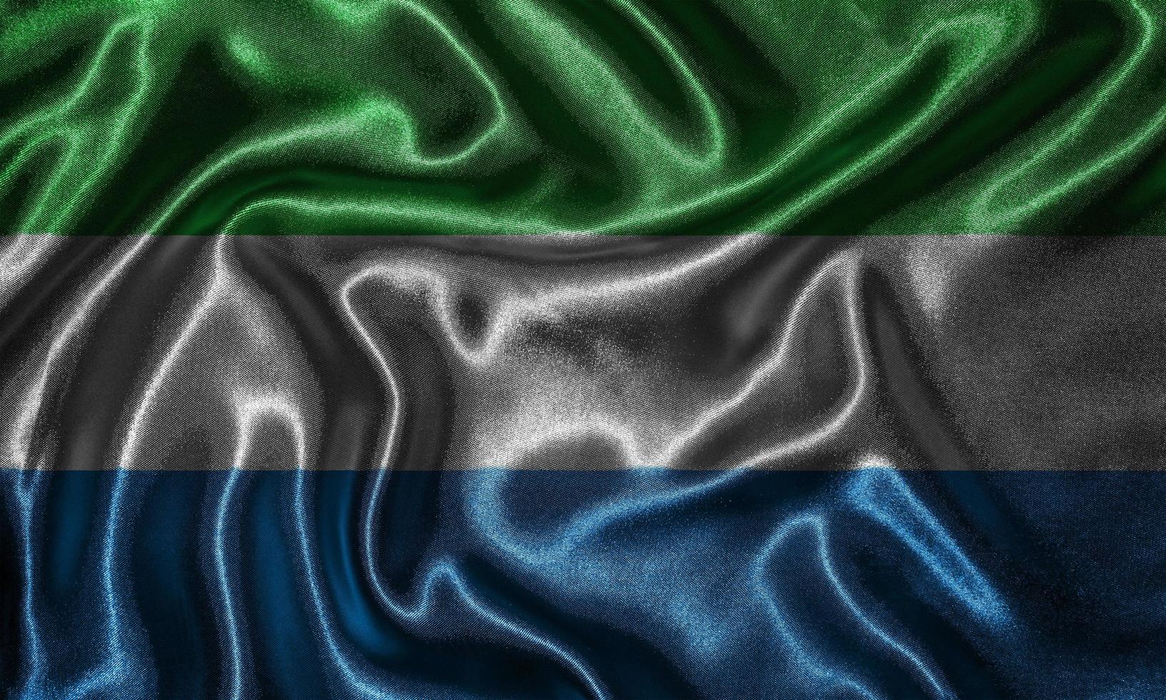 Wallpaper by Sierra Leone flag and waving flag by fabric. photo