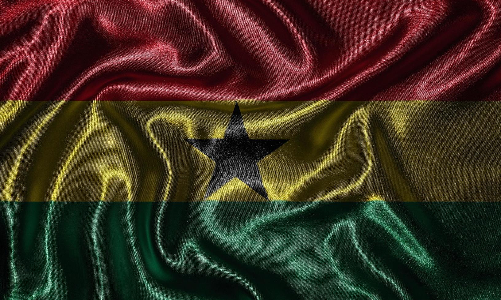 papel tapiz con la bandera de ghana y bandera ondeando por tela. foto