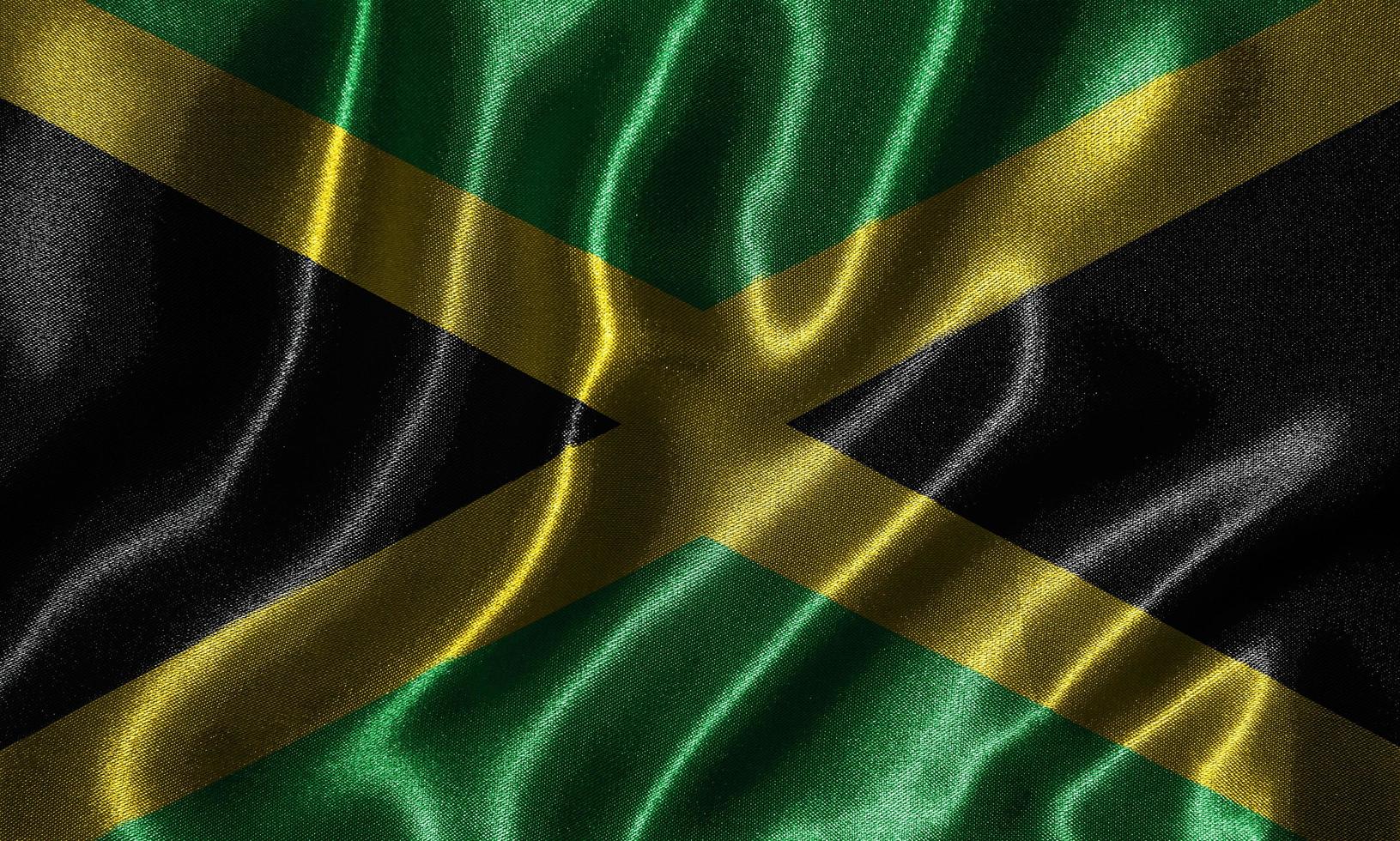 papel tapiz de la bandera de jamaica y bandera ondeando por tela. foto