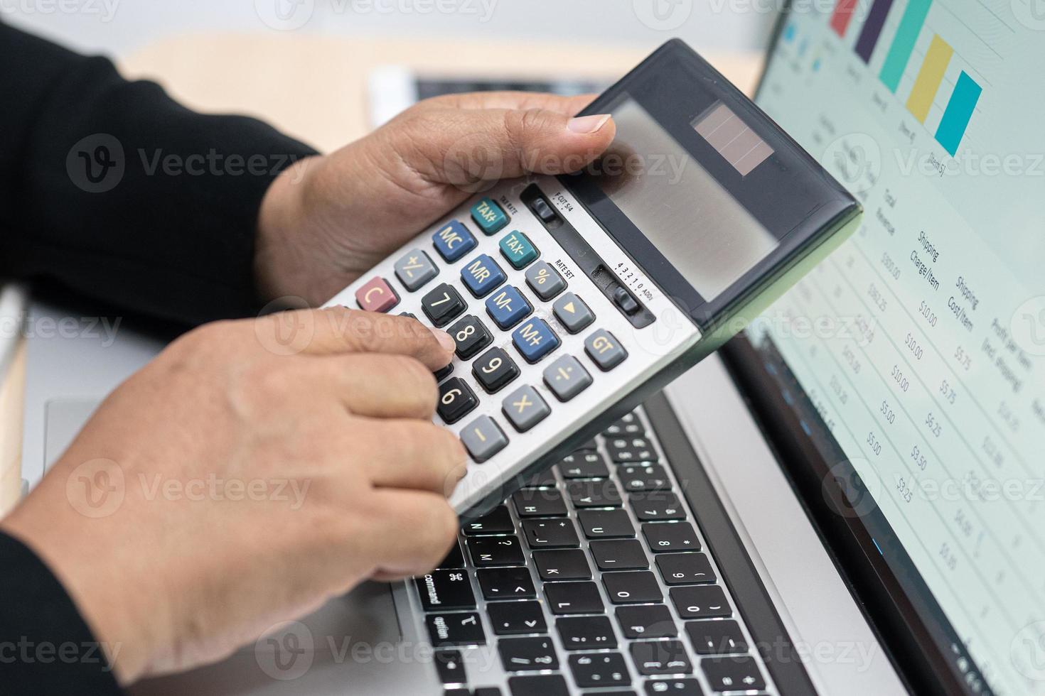 Asian accountant working and analyzing financial reports project photo