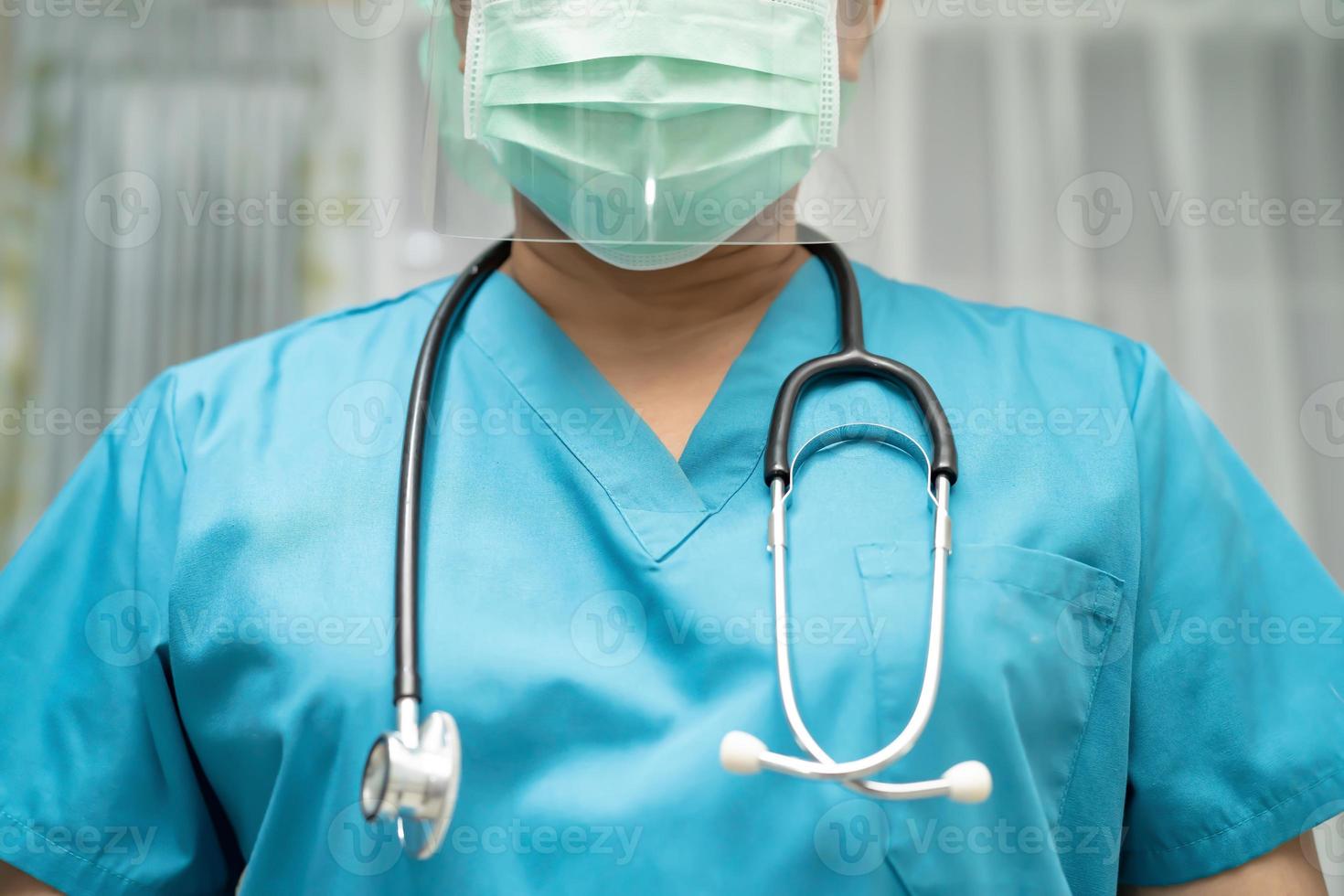 Asian doctor wearing face shield and PPE suit protect Coronavirus photo