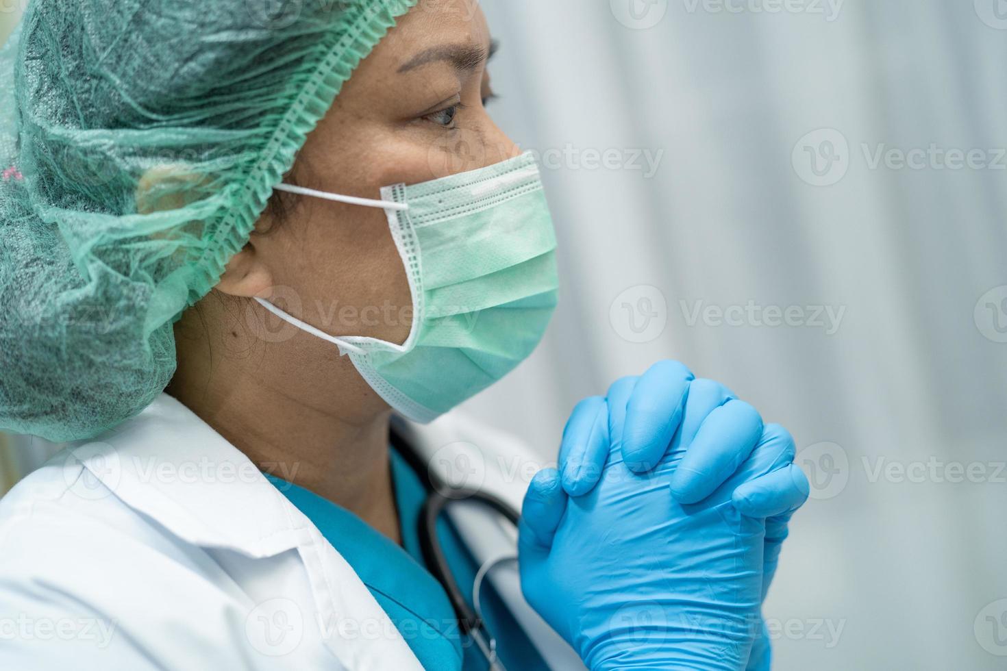 Asian doctor wearing face shield and PPE suit protect Coronavirus photo