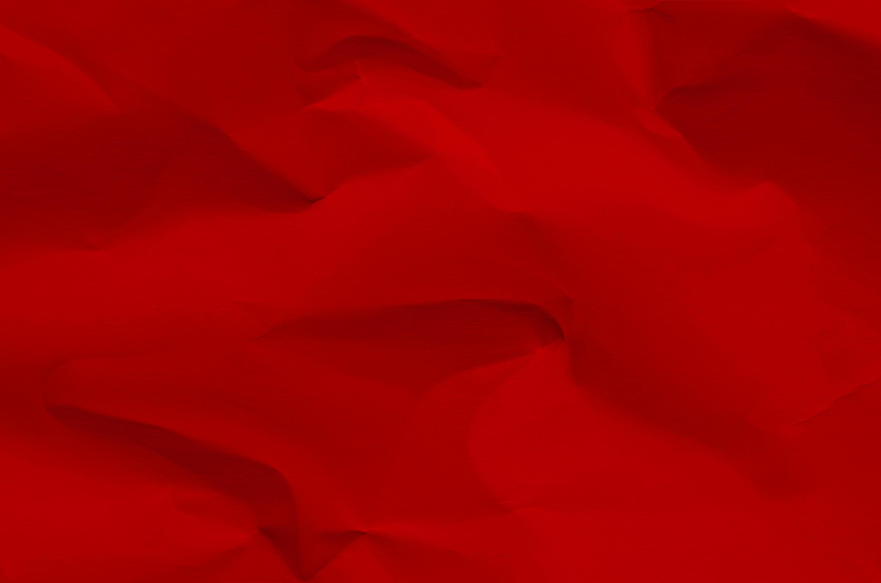 Fondo rojo y papel tapiz por textura de papel arrugado y espacio libre